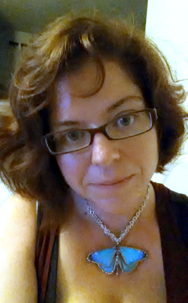 Staci B loves her blue morpho necklace